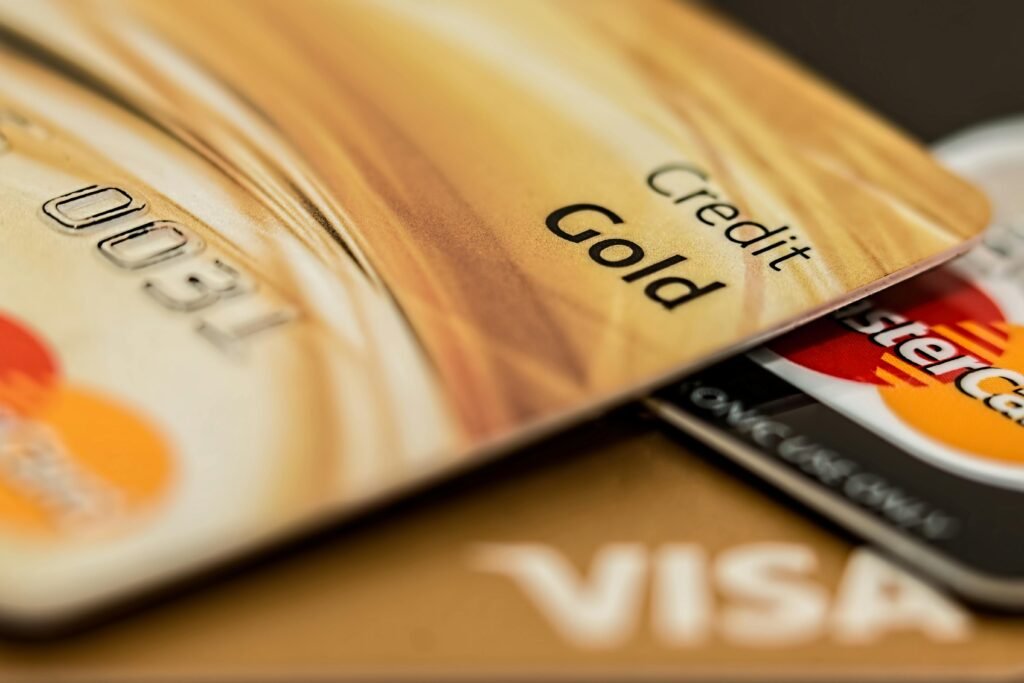 pexels-photo-164501-164501 Stack of various branded credit cards focusing on gold card showing finance and cashless concept.